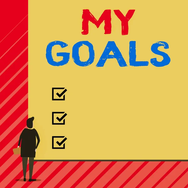 Handwriting text writing My Goals. Concept meaning Future or desired result that a demonstrating commits to achieve Man stands in back view in front of huge empty blank big rectangle board.