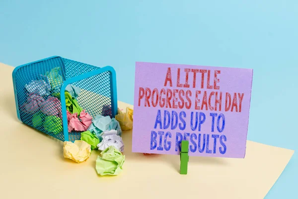 Word writing text A Little Progress Each Day Adds Up To Big Results. Business concept for Step by step reach goal Trash bin crumpled paper clothespin empty reminder office supplies tipped.