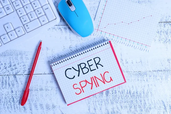 Conceptual hand writing showing Cyber Spying. Business photo text form of cyber attack that steals classified or sensitive data Wood desk office appliance computer equipaments charts paper slot.