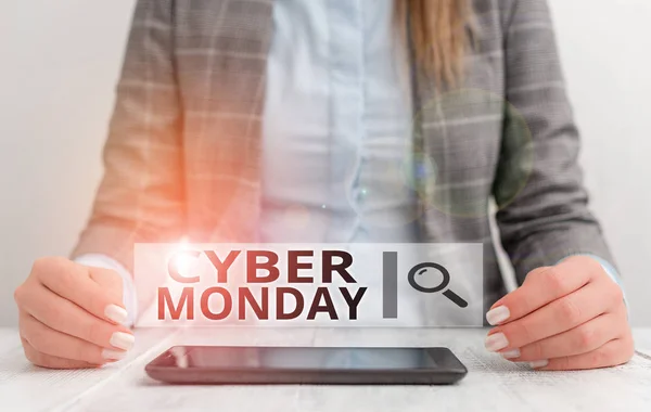 Handwriting text writing Cyber Monday. Concept meaning Monday after the Thanksgiving holiday Online shopping day Business woman sitting with mobile phone on the table.