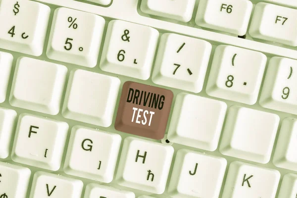 Handwriting text writing Driving Test. Concept meaning procedure to test a demonstrating s is ability to drive a motor vehicle White pc keyboard with empty note paper above white background key copy — Stock Photo, Image