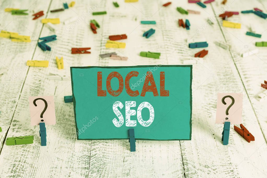 Word writing text Local Seo. Business concept for This is an effective way of marketing your business online Scribbled and crumbling sheet with paper clips placed on the wooden table.