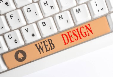 Kelime yazma metni Web Design. Beyaz arka plan tuşu kopyalama alanı üzerinde boş not kağıdı ile web sitelerinin üretim ve bakım sorumlu kim için İş kavramı.