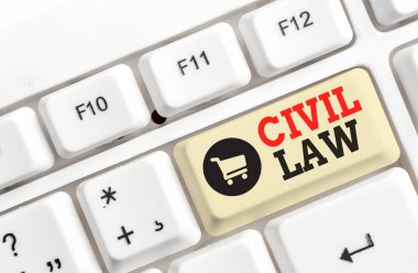 Medeni Hukuk'u gösteren bir metin işareti. Kavramsal fotoğraf Hukuk beyaz arka plan tuşu kopyalama alanı üzerinde boş not kağıdı ile topluluk Beyaz pc klavye üyeleri arasındaki özel ilişkiler ile ilgili.