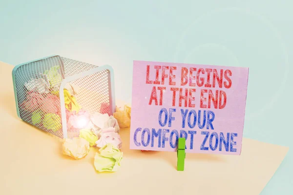 Word writing text Life Begins At The End Of Your Comfort Zone. Business concept for Make changes evolve grow Trash bin crumpled paper clothespin empty reminder office supplies tipped.