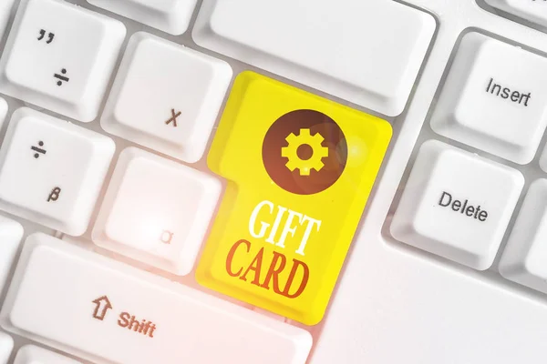 Conceptual hand writing showing Gift Card. Business photo showcasing A present usually made of paper that contains your message White pc keyboard with note paper above the white background. — Stock Photo, Image