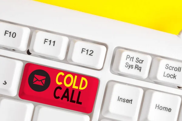 Text sign showing Cold Call. Conceptual photo Unsolicited call made by someone trying to sell goods or services White pc keyboard with empty note paper above white background key copy space.