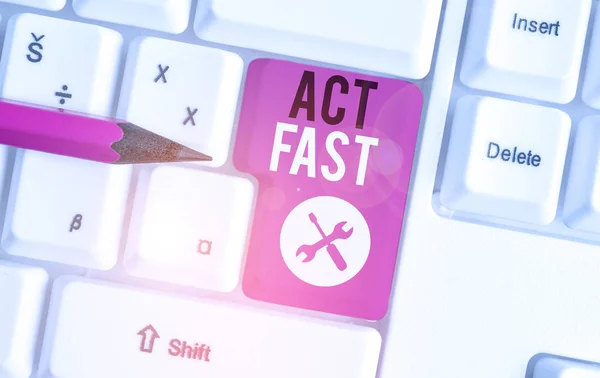 Text sign showing Act Fast. Conceptual photo Voluntarily move in the highest state of speed initiatively White pc keyboard with empty note paper above white background key copy space.