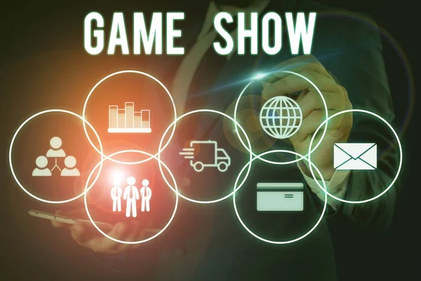 Word writing text Game Show. Business concept for Program in television or radio with players that win prizes Male human wear formal work suit presenting presentation using smart device.