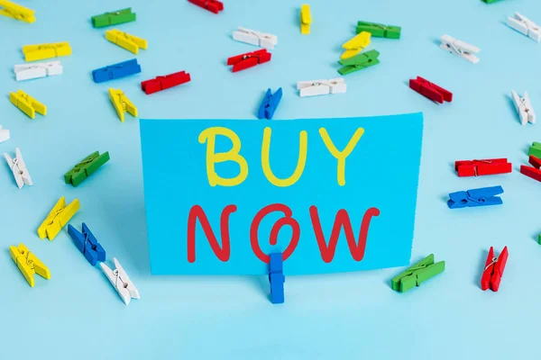 Handwriting text Buy Now. Concept meaning asking someone to purchase your product Provide good Discount Colored clothespin papers empty reminder blue floor background office pin. — Stock Photo, Image