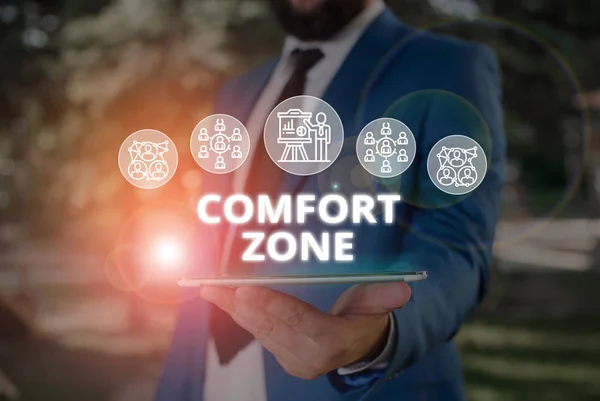 Word writing text Comfort Zone. Business concept for place or situation where one feels safe and without stress Male human wear formal work suit presenting presentation using smart device.