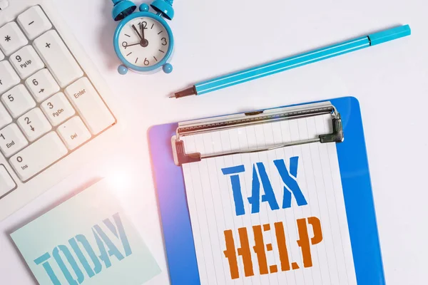 Writing note showing Tax Help. Business photo showcasing Assistance from the compulsory contribution to the state revenue Flat lay above table with clock pc keyboard and copy space note paper. — Stock Photo, Image