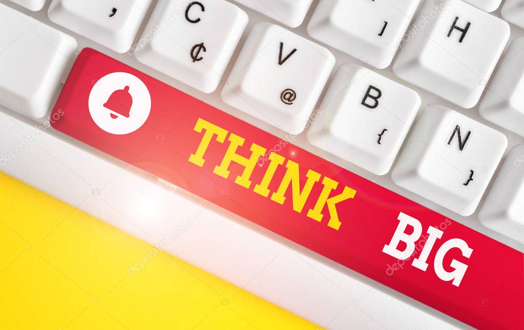 Text sign showing Think Big. Conceptual photo To plan for something high value for ones self or for preparation White pc keyboard with empty note paper above white background key copy space.