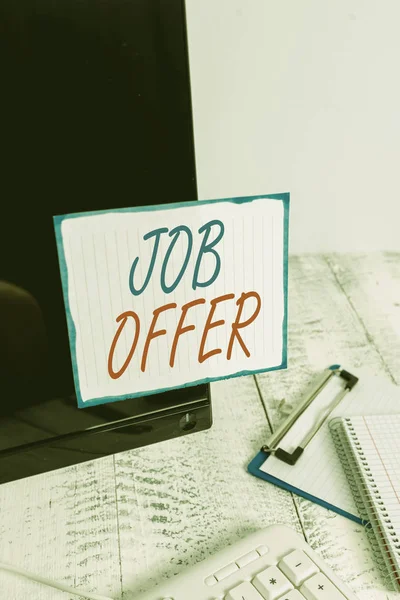 Writing note showing Job Offer. Business photo showcasing A peron or company that gives opurtunity for one s is employment Note paper taped to black computer screen near keyboard and stationary.