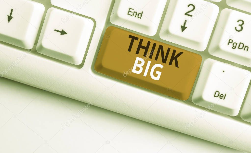 Writing note showing Think Big. Business photo showcasing To plan for something high value for ones self or for preparation White pc keyboard with note paper above the white background.