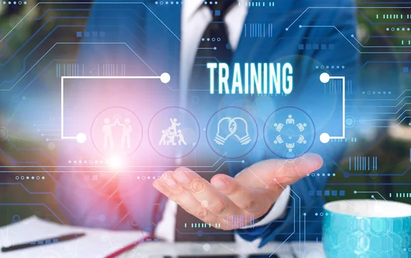 Text sign showing Training. Conceptual photo An activity occurred when starting a new job project or work Male human wear formal work suit presenting presentation using smart device. — Stock Photo, Image