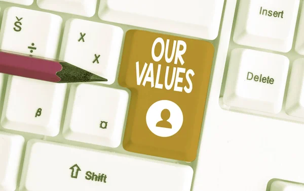 Conceptual hand writing showing Our Values. Business photo text list of morals companies or individuals commit to do them White pc keyboard with note paper above the white background.