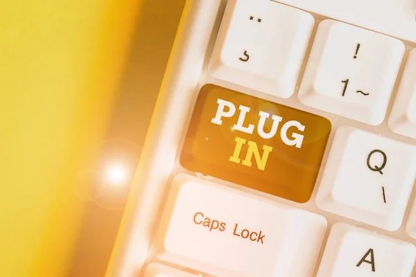 Text sign showing Plug In. Conceptual photo putting device into electricity to turn it on Power it Connecting White pc keyboard with empty note paper above white background key copy space. — Stock Photo, Image