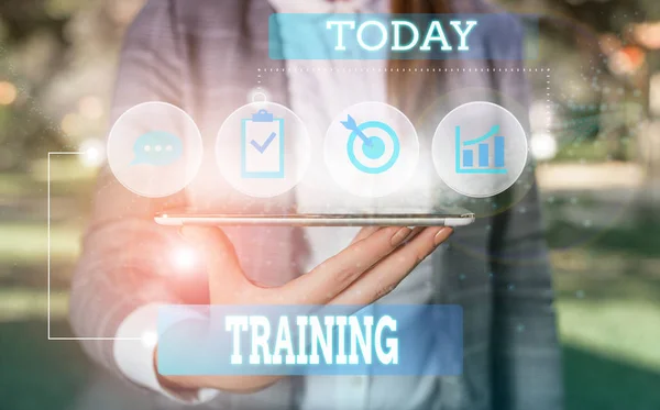 Text sign showing Training. Conceptual photo An activity occurred when starting a new job project or work Female human wear formal work suit presenting presentation use smart device. — Stock Photo, Image