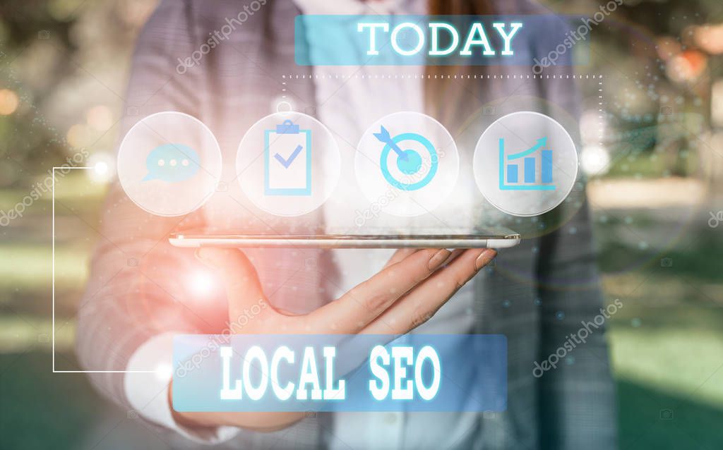 Text sign showing Local Seo. Conceptual photo This is an effective way of marketing your business online Female human wear formal work suit presenting presentation use smart device.