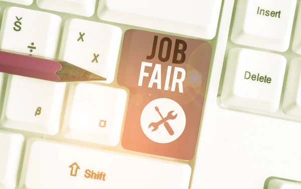 Text sign showing Job Fair. Conceptual photo An event where a demonstrating can apply for a job in multiple companies White pc keyboard with empty note paper above white background key copy space.