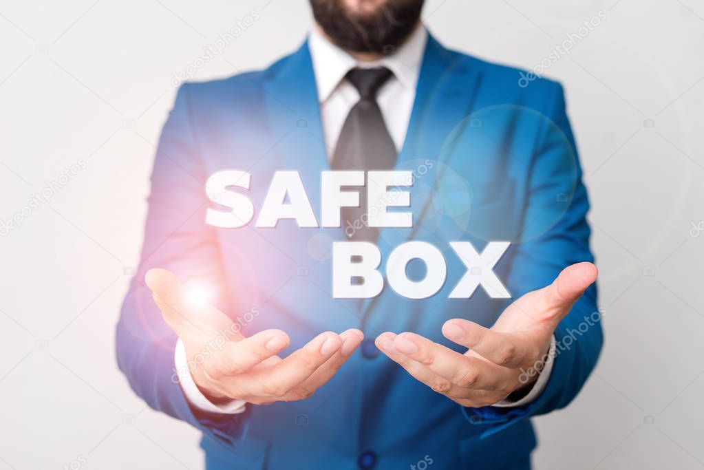 Text sign showing Safe Box. Conceptual photo A small structure where you can keep important or valuable things Man with opened hands in fron of the table. Mobile phone and notes on the table.