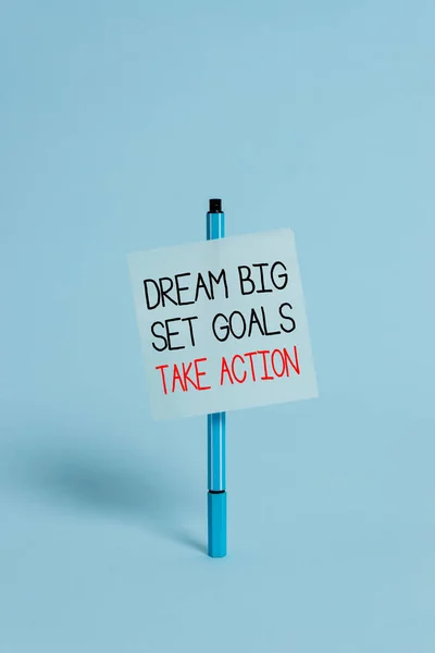 Text sign showing Dream Big Set Goals Take Action. Conceptual photo Motivation to follow your dreams Inspiration Ballpoint blank colored sticky note peaceful cool pastel fashion background.