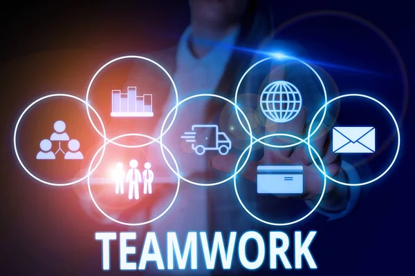 Writing note showing Teamwork. Business photo showcasing Group of showing who work together as one and with the same aim Woman wear formal work suit presenting presentation using smart device. — Stock Photo, Image