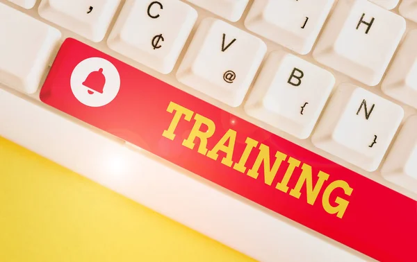 Text sign showing Training. Conceptual photo An activity occurred when starting a new job project or work White pc keyboard with empty note paper above white background key copy space. — Stock Photo, Image