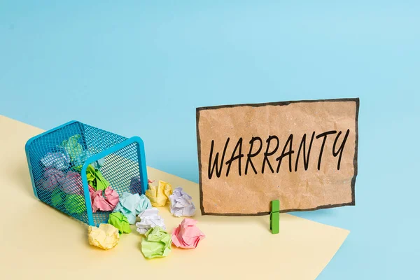 Handwriting text writing Warranty. Concept meaning Free service of repair and maintenance of the product sold Trash bin crumpled paper clothespin empty reminder office supplies tipped.