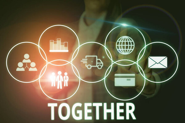 Writing note showing Together. Business photo showcasing In proximity,union or collison with another demonstrating or things Woman wear formal work suit presenting presentation using smart device.