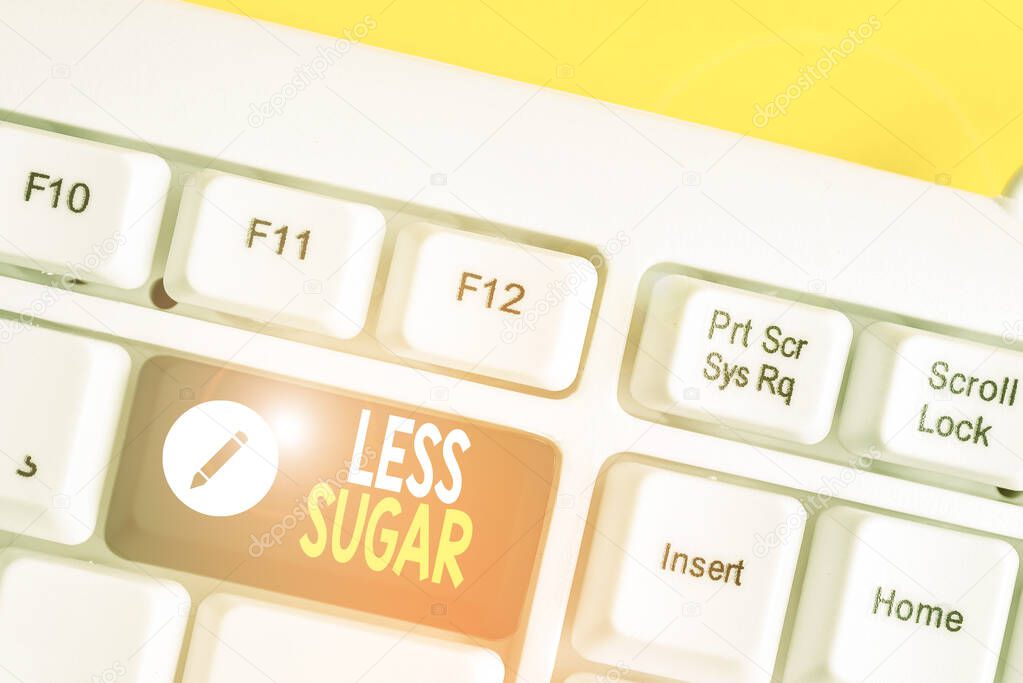 Writing note showing Less Sugar. Business photo showcasing Lower volume of sweetness in any food or drink that we eat White pc keyboard with note paper above the white background.