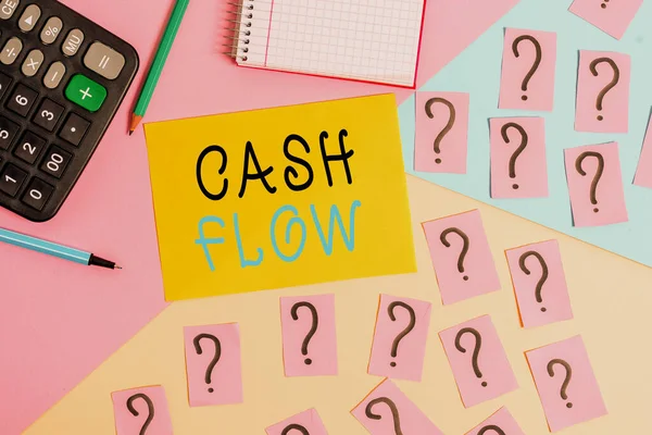 Conceptual hand writing showing Cash Flow. Business photo text Movement of the money in and out affecting the liquidity Mathematics stuff and writing equipment on pastel background. — ストック写真