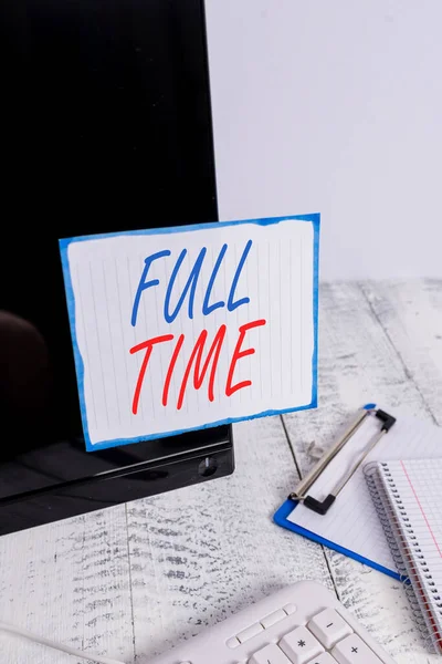 Writing note showing Full Time. Business photo showcasing working or operating the customary number of hours in a day Note paper taped to black computer screen near keyboard and stationary. — Stock Photo, Image