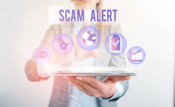 Conceptual hand writing showing Scam Alert. Business photo showcasing warning someone about scheme or fraud notice any unusual Female human wear formal work suit presenting smart device. — Stock Photo, Image