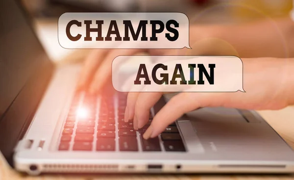 Writing note showing Champs Again. Business photo showcasing refers to winner or someone who excels and enjoys victories woman with laptop smartphone and office supplies technology. — 스톡 사진
