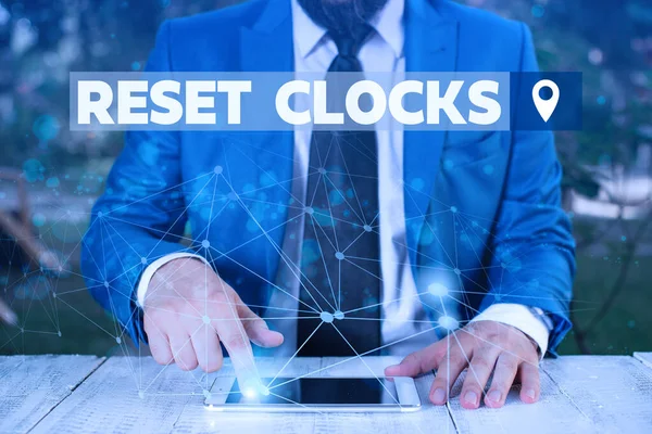 Word writing text Reset Clocks. Business concept for To revisit return to or recreate a time or era from the past Male human wear formal work suit presenting presentation using smart device. — Φωτογραφία Αρχείου