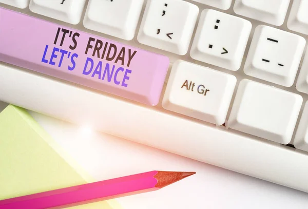 Text sign showing It S Friday Let S Dance. Conceptual photo Celebrate starting the weekend Go party Disco Music White pc keyboard with empty note paper above white background key copy space.