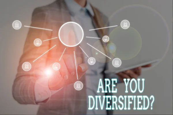 Conceptual hand writing showing Are You Diversified Question. Business photo text someone who is Different Mixed Multi Faceted Woman wear work suit presenting presentation using smart device. — Stockfoto