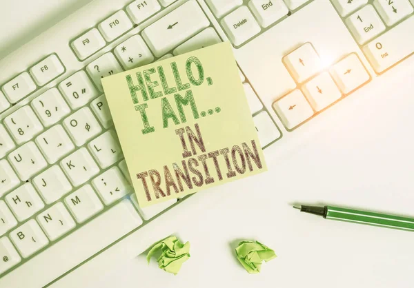 Writing note showing Hello I Am In Transition. Business photo showcasing Changing process Progressing planning new things Green note paper with pencil on white background and pc keyboard. — Stock Photo, Image