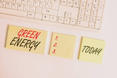 Word writing text Green Energy. Business concept for comes from natural sources and does not harm the ecosystem Flat lay above blank copy space sticky notes with business concept. clipart