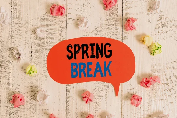 Conceptual hand writing showing Spring Break. Business photo text week s is vacation for students in the spring typically at Easter Colored speech bubble paper balls wooden rustic vintage background. — Stock Photo, Image