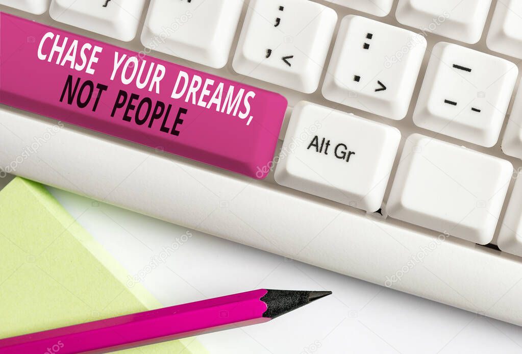 Conceptual hand writing showing Chase Your Dreams Not People. Business photo text Do not follow others chasing goals objectives White pc keyboard with note paper above the white background.