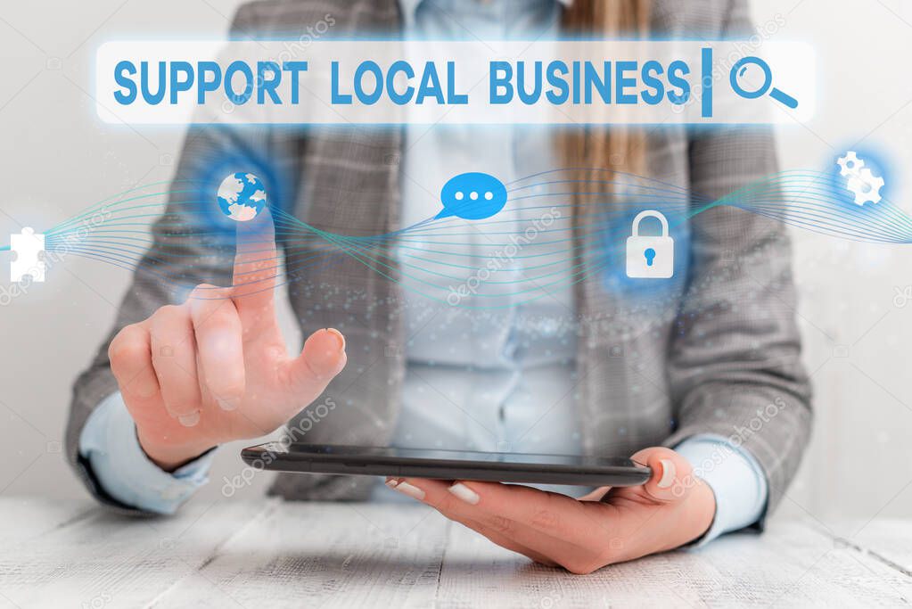Text sign showing Support Local Business. Conceptual photo increase investment in your country or town Female human wear formal work suit presenting presentation use smart device.