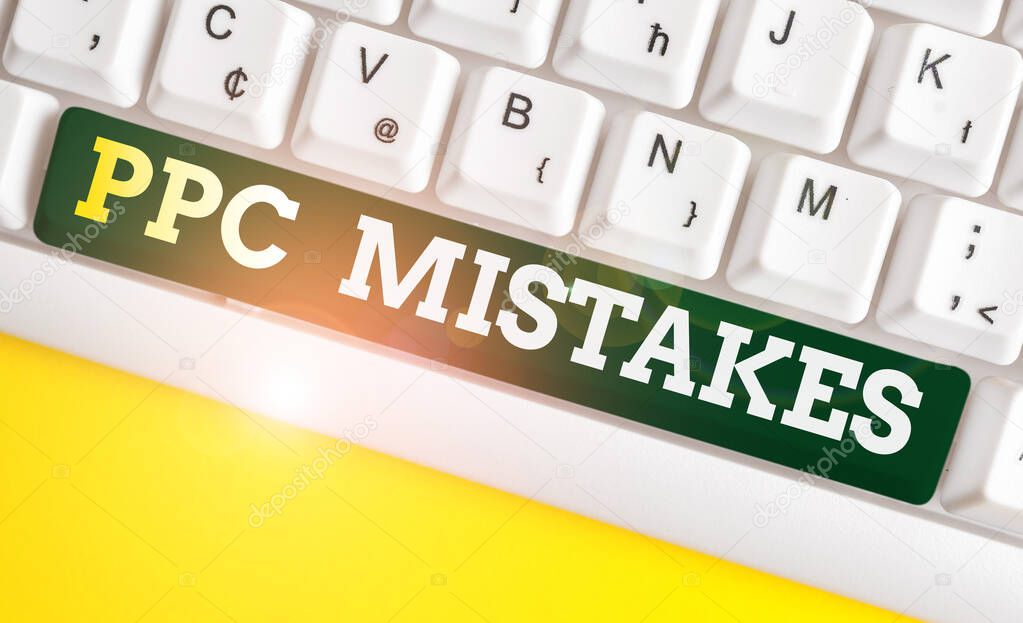 Writing note showing Ppc Mistakes. Business photo showcasing judgment that is misguided or wrong in pay per click scheme White pc keyboard with note paper above the white background.
