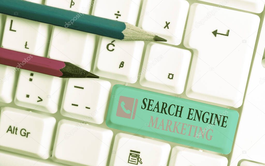 Word writing text Search Engine Marketing. Business concept for promote Website visibility on searched result pages White pc keyboard with empty note paper above white background key copy space.