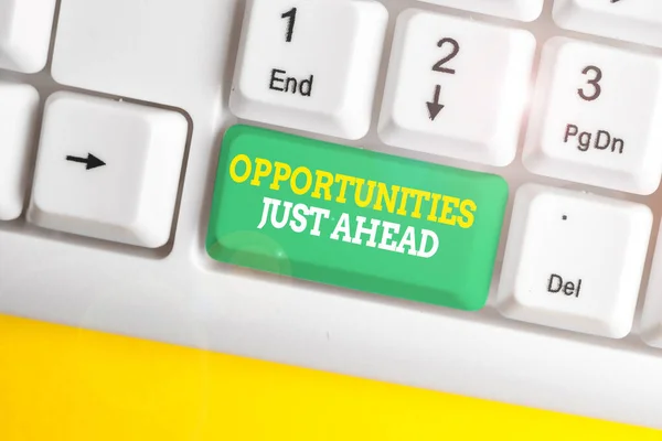 Writing note showing Opportunities Just Ahead. Business photo showcasing Advantageous circumstances Perseverance pays off White pc keyboard with note paper above the white background.