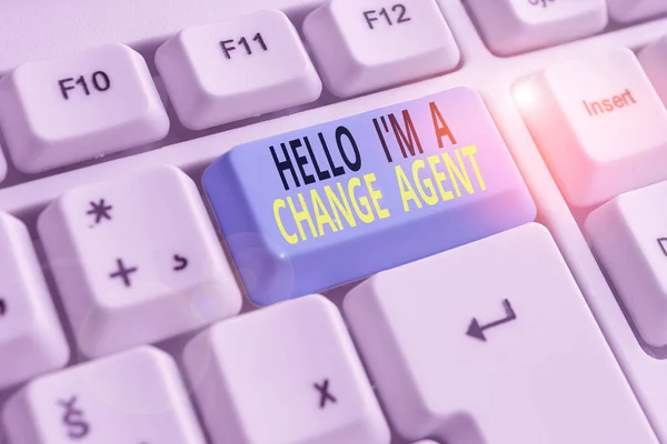 Text sign showing Hello I M A Change Agent. Conceptual photo Promoting and enabling difference evolution new White pc keyboard with empty note paper above white background key copy space.