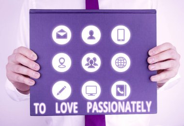 Handwriting text writing To Love Passionately. Concept meaning Strong feeling for someone or something else Affection Male human holding thick textured cardboard of business promotion concept.