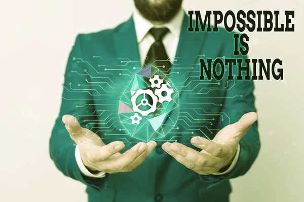 Writing note showing Impossible Is Nothing. Business photo showcasing Anything is Possible Believe the Realm of Possibility Male human wear formal suit presenting using smart device. — Stock Photo, Image